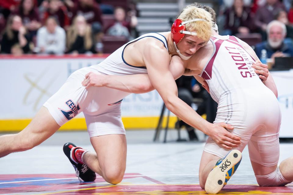 Lebanon's Griffin Gonzalez (left) wrestles Altoona's Luke Sipes in the 152-pound 7th-place bout at the PIAA Class 3A Wrestling Championships at the Giant Center on March 11, 2023, in Hershey. Sipes won by decision, 3-1.