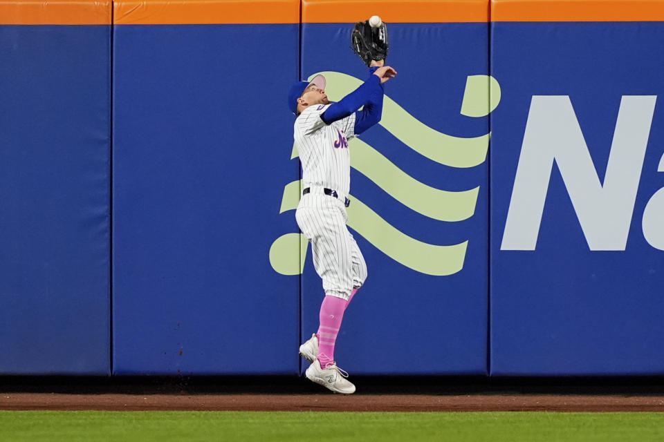 New York Mets outfielder Brandon Nimmo (9) catches a ball hit by Atlanta Braves' Orlando Arcia during the eighth inning of a baseball game, Sunday, May 12, 2024, in New York. The Mets won 4-3. (AP Photo/Julia Nikhinson)