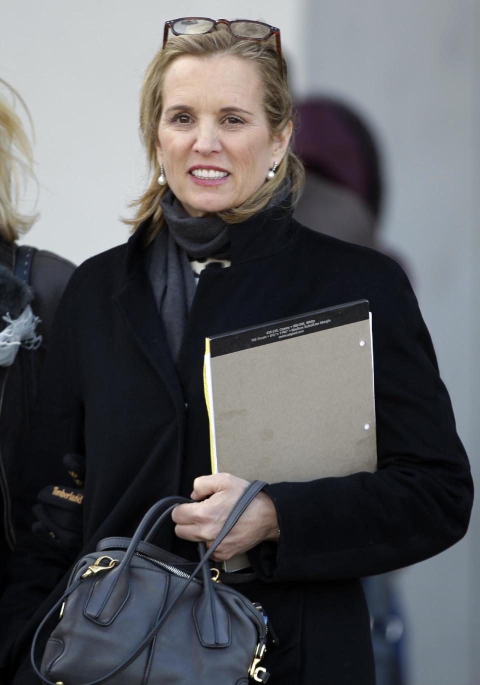 Kerry Kennedy, center, leaves Westchester County courthouse with family members Wednesday, Feb. 26, 2014, in White Plains, N.Y. Kennedy testified at her drugged-driving trial Wednesday that she has no memory of swerving and hitting a tractor-trailer on a suburban New York highway and did not realize she was impaired when she got behind the wheel. (AP Photo/Frank Franklin II)