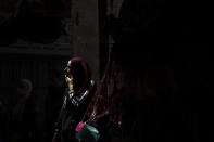 A Palestinian woman passes through Damascus Gate to leave the Old City of Jerusalem after Friday prayers during the Muslim holy month of Ramadan, on Friday, April 23, 2021. Israeli police say 44 people were arrested and 20 officers were wounded in a night of chaos in Jerusalem, where security forces separately clashed with Palestinians angry about Ramadan restrictions and Jewish extremists who held an anti-Arab march nearby. (AP Photo/Maya Alleruzzo)