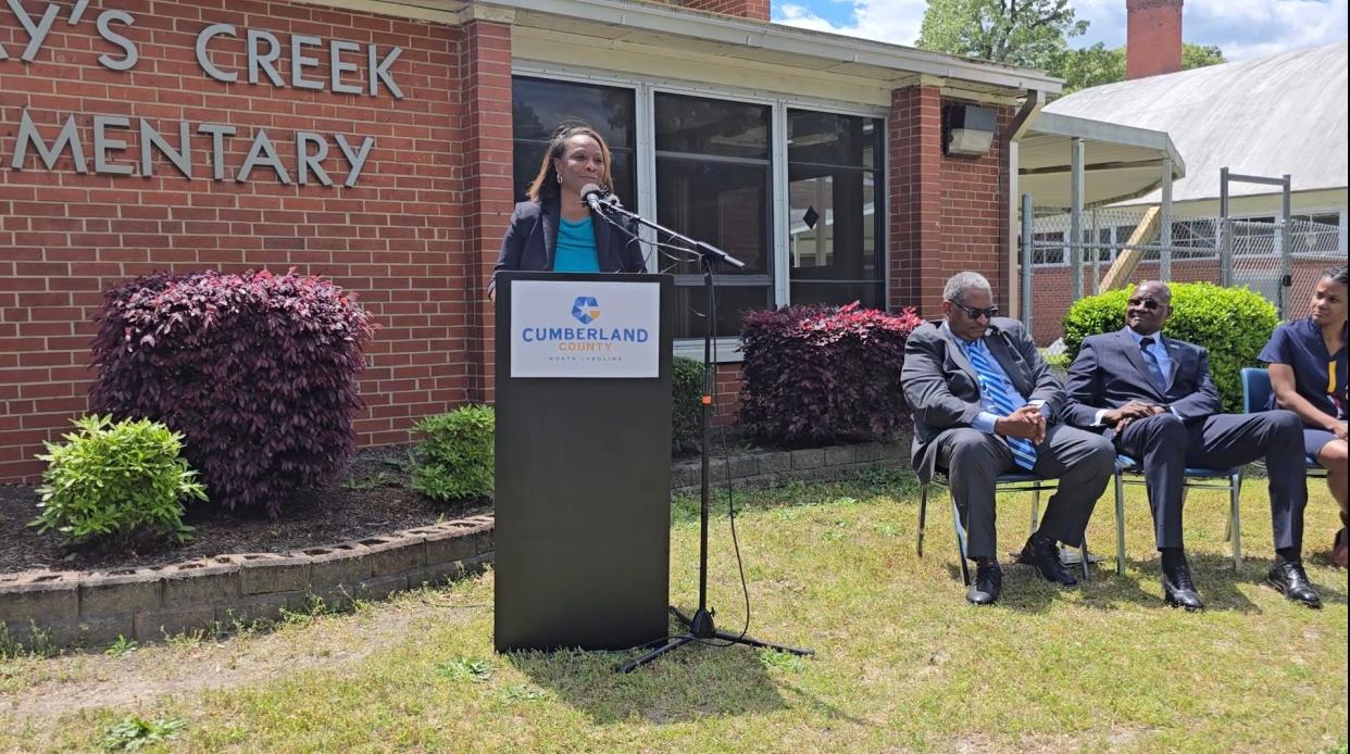 Cumberland County Commissioner Dr. Toni Stewart speaks during a press conference on Friday, April 12, 2024, where officials announced a partnership between Cumberland County and the Public Works Commission. The PWC intends to extend water service to Gray's Creek in Cumberland County. Also pictured: Glenn Adams, commissioner chair, left; Donald L. Porter, the chair of the PWC; and Dr. Jennifer Green, the county Health Director.