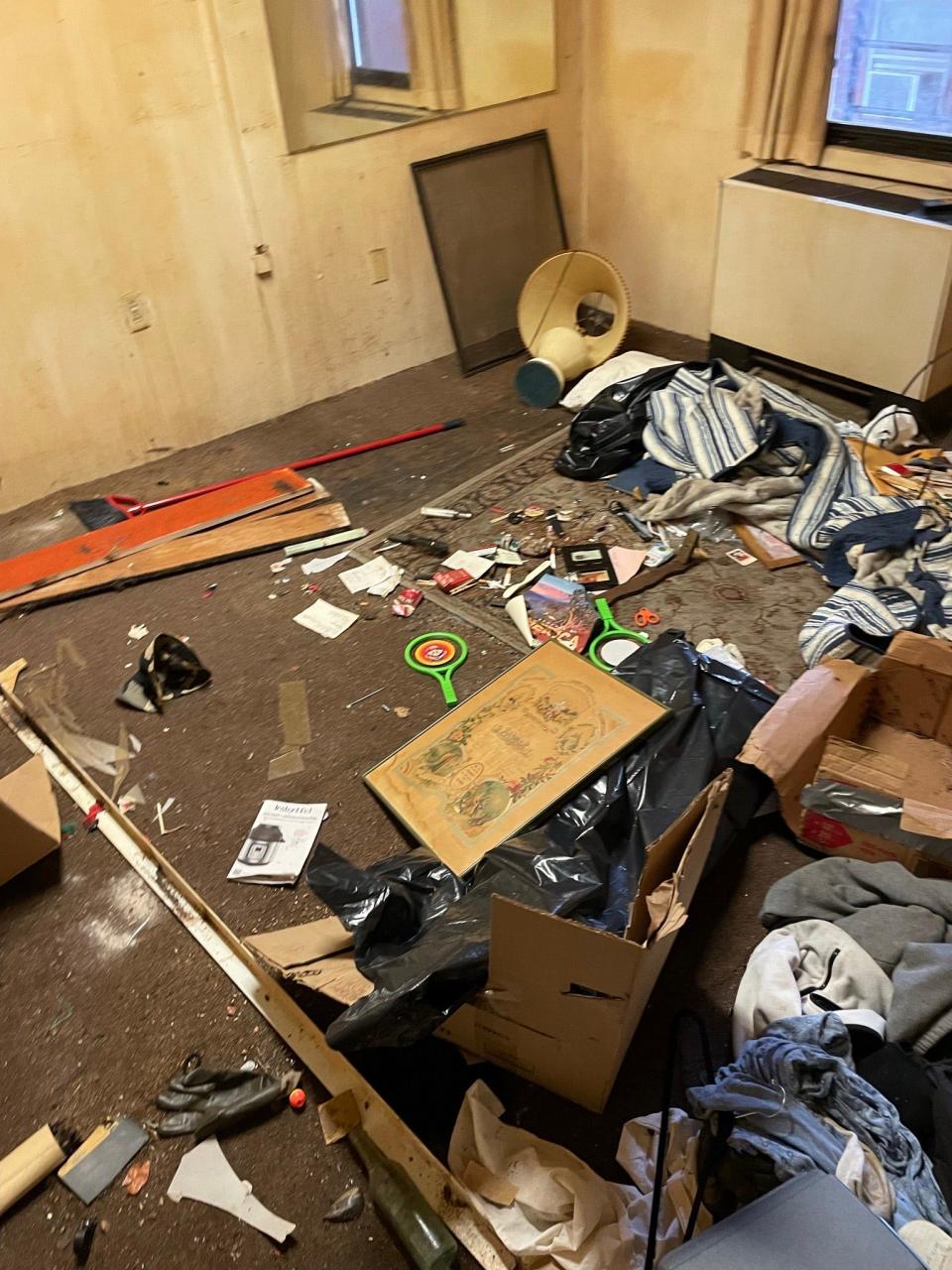 Photos of Room 102 at the Bush House hotel show dirty walls and carpets, though renters were promised weekly maid service. Craig Bennett, who lived in this room until August, said that he paid $900 a month cash and had no lease.