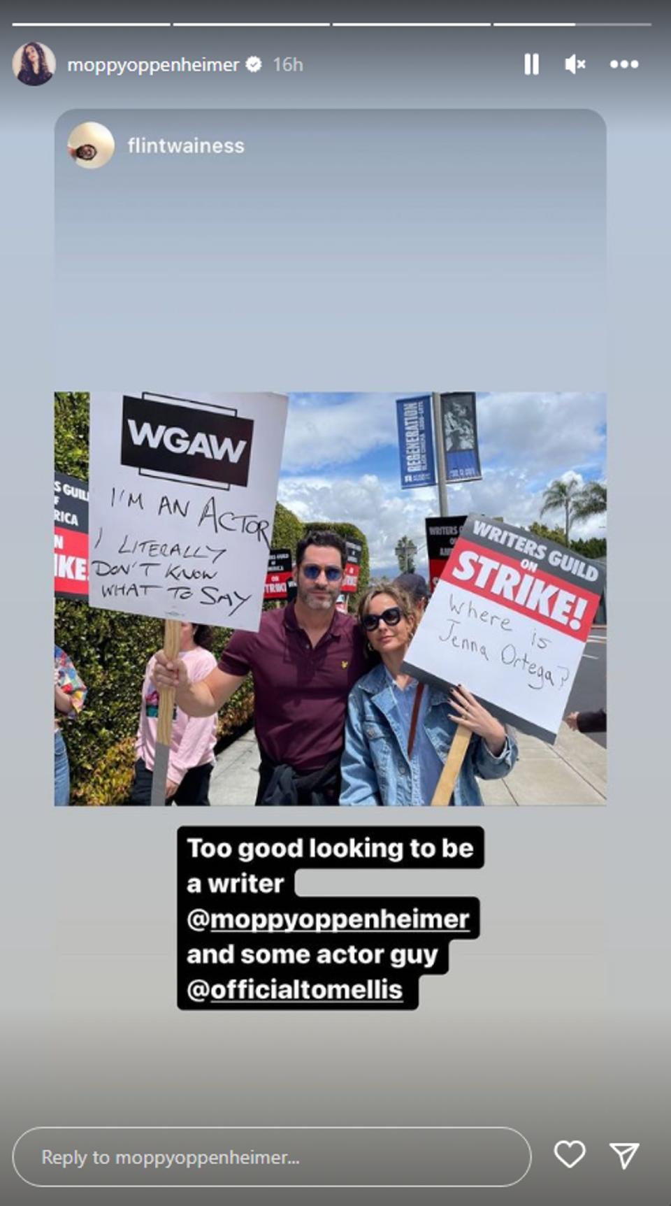 Meaghan Oppenheimer holding a sign that says 