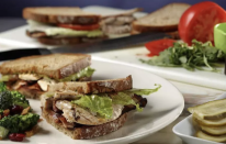 <p>It’s no secret that perfect roast chicken makes any sandwich spectacular. Add thin slices of tomato, a generous smear of mayonnaise, a few tablespoons of sun-dried tomato pesto, baby arugula and thick slices of hickory-smoked bacon and you’ve entered sandwich heaven. </p> <p><a href="https://www.thedailymeal.com/best-recipes/roast-chicken-bacon-sandwiches?referrer=yahoo&category=beauty_food&include_utm=1&utm_medium=referral&utm_source=yahoo&utm_campaign=feed" rel="nofollow noopener" target="_blank" data-ylk="slk:For the Roast Chicken and Bacon Sandwich recipe, click here.;elm:context_link;itc:0;sec:content-canvas" class="link ">For the Roast Chicken and Bacon Sandwich recipe, click here. </a></p>