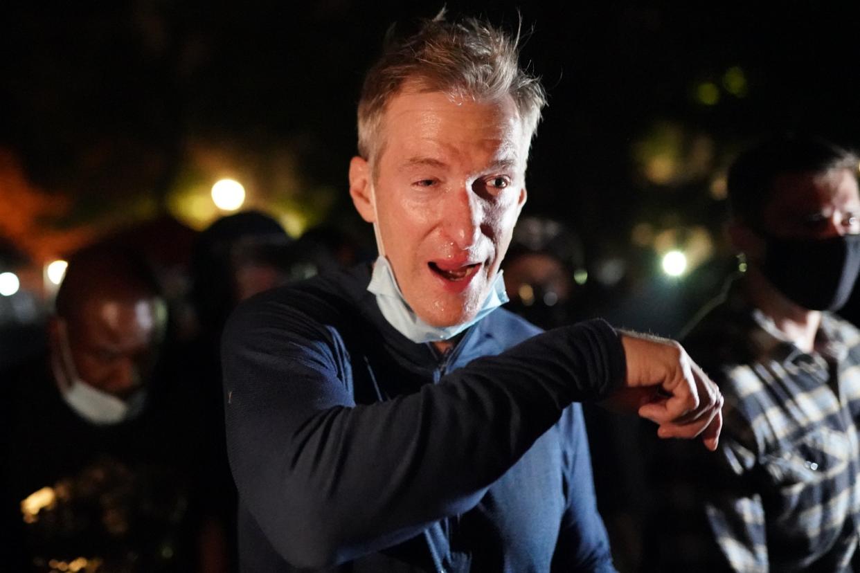 Portland Mayor Ted Wheeler reacts after being exposed to tear gas fired by federal officers while attending a protest against police brutality and racial injustice in front of the Mark O. Hatfield U.S. Courthouse on July 22, 2020 in Portland, Oregon: Getty Images