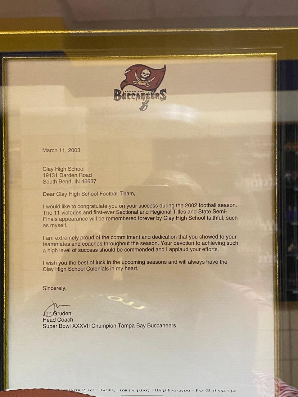 A letter written by then-Tampa Bay Buccaneers coach Jon Gruden to the 2002 South Bend Clay football team is displayed at the school. Gruden is a Clay alum.