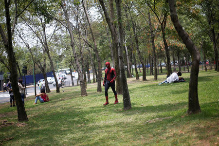 Moises Vazquez, 26, known as Spider-Moy, a computer science teaching assistant at the Faculty of Science of the National Autonomous University of Mexico (UNAM), who teaches dressed as a comic superhero Spider-Man, walks at the university campus in Mexico City, Mexico, May 27, 2016. REUTERS/Edgard Garrido