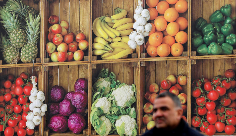 A man walks past a Nisa Grocers delivery lorry with fruit and vegetable livery in Wolverhampton, Britain January 29, 2018. REUTERS/Darren Staples