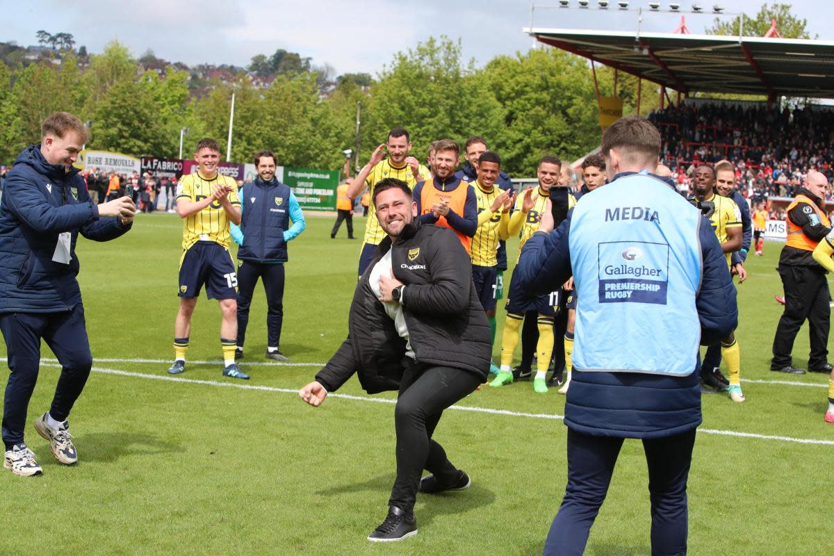 Oxford United head coach Des Buckingham celebrates with the away end at full-time <i>(Image: Steve Edmunds)</i>