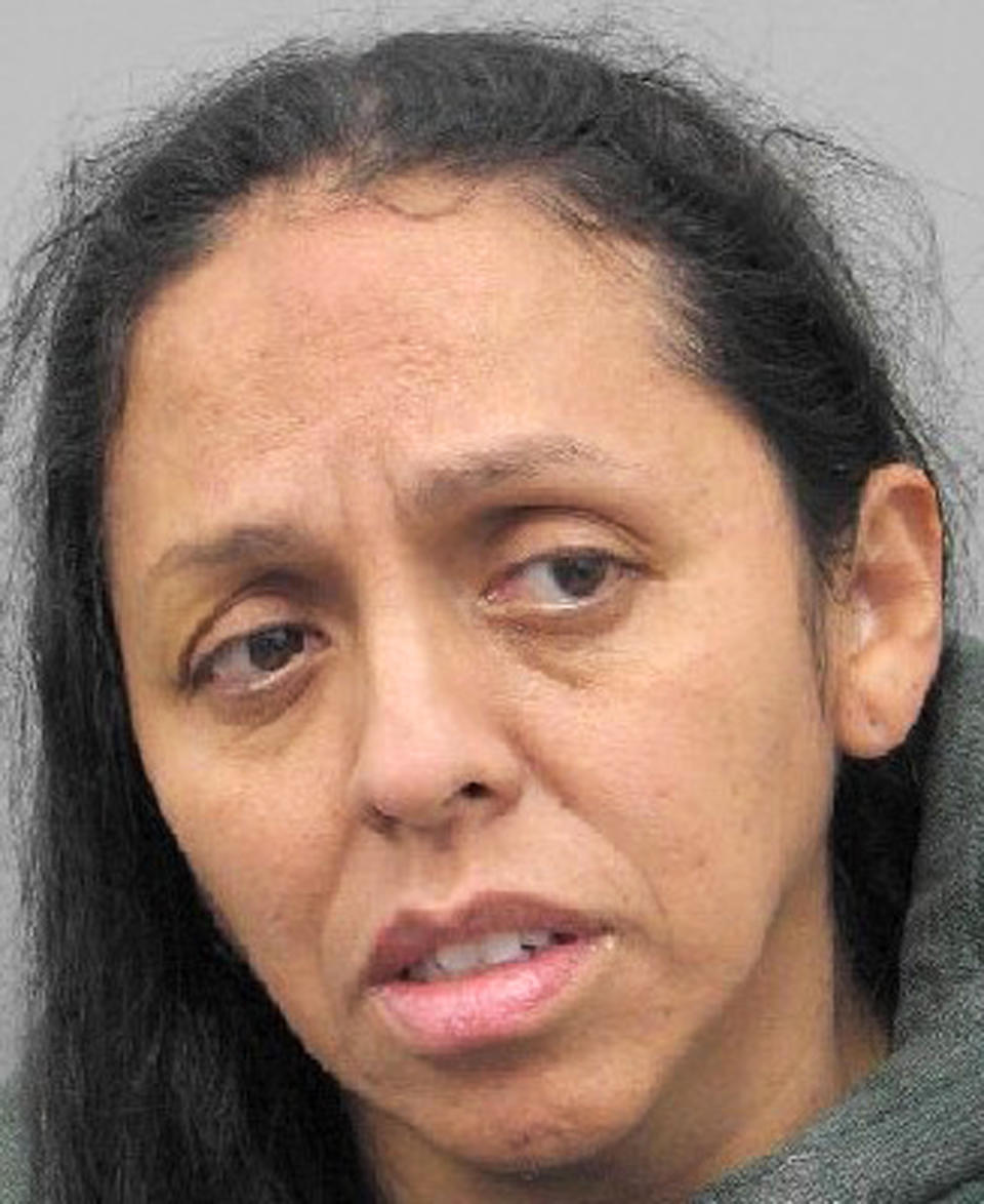 This undated Henderson Detention Center booking photo shows Rita Angelina Colon, 44, following her return in custody on Thursday, Oct. 31, 2019, from Peru to the Las Vegas area. Colon faces separate murder charges in Henderson, Nev., in the fatal stabbing of a retired UNLV professor in 2016, and in the stabbing death of her husband in 2005 in North Las Vegas. (Henderson Police Department via AP)