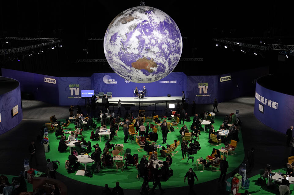 Delegates gather inside the venue on another day at the COP26 U.N. Climate Summit in Glasgow, Scotland, Wednesday, Nov. 3, 2021. The U.N. climate summit in Glasgow gathers leaders from around the world, in Scotland's biggest city, to lay out their vision for addressing the common challenge of global warming. (AP Photo/Alberto Pezzali)