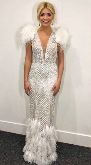 <p>For the Dancing on Ice final, Holly Willoughby stunned viewers in a couture gown by Nedretta Ciroglu. She accessorised the angelic look with co-ordinating jewels by Anoushka Jewellery and Prada heels. <em>[Photo: Instagram]</em> </p>