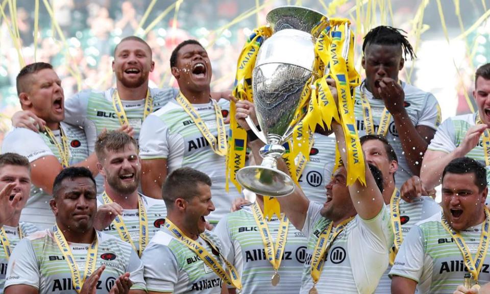 Saracens’ Brad Barritt lifts the trophy as they celebrate after winning the Premiership final.