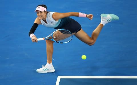 Muguruza chases down a return - Credit: Getty Images