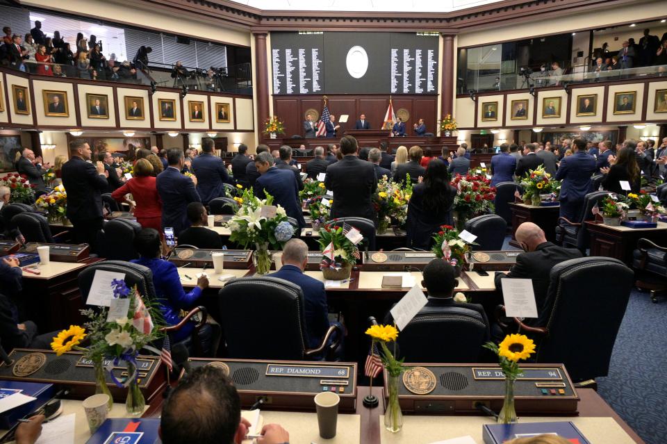 Florida Gov. Ron DeSantis, rear center, addresses a joint session of the legislature, Tuesday, Jan. 11, 2022, in Tallahassee, Fla.