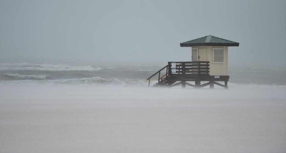 Blowing sand and rain from Tropical Storm Nicole obscures the view at Lido Beach in Sarasota, Florida on Thursday, Nov. 10, 2022. 