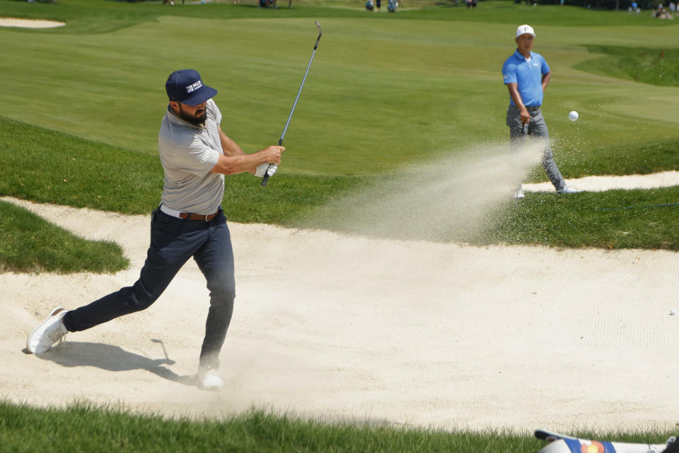 Mark Hubbard hits from a trap on the sixth hole during the second round at the 3M Open golf tournament at the Tournament Players Club, Friday, July 28, 2023, in Blaine, Minn. (AP Photo/Bruce Kluckhohn)