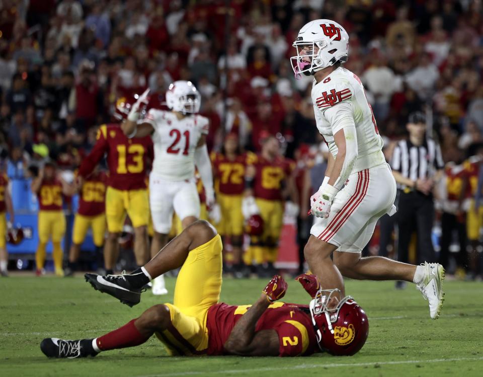 USC Trojans wide receiver Brenden Rice (2) lays on the ground after getting tackled by Utah Utes safety Cole Bishop (8) at the Los Angeles Memorial Coliseum on Saturday, Oct. 21, 2023.