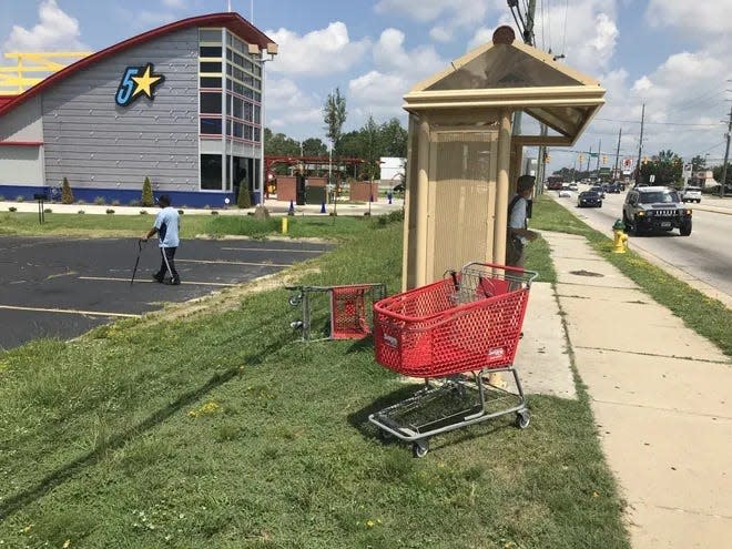 Two shopping carts that were abandoned by a bus stop on Ramsey Street in 2019. The City Council was annoyed then by the number of discarded shopping carts littering the streets, continues to be bothered by them in 2023. The council may create new regulations to address the issue.