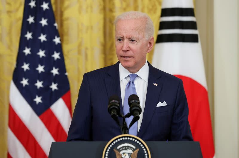 FILE PHOTO: U.S. President Joe Biden speaks to journalists at the White House, in Washington