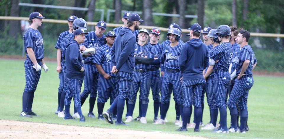 St. Thomas Aquinas head baseball coach talks to his team following Wednesday's 9-3 loss to Hollis-Brookline in a Division III semifinal at Memorial Field in Concord.