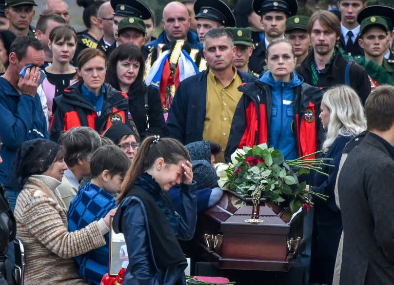 Mourners attended a funeral ceremony for the victims of the school shooting in the Russian-annexed Crimea city of Kerch