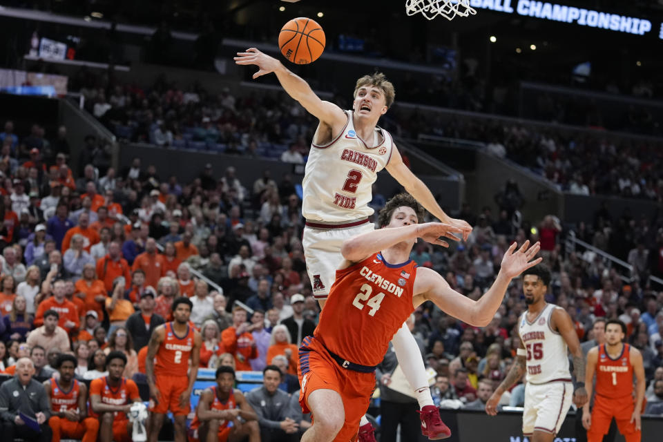 Alabama forward Grant Nelson (2) blocks a shot from Clemson center PJ Hall (24) during the second half of an Elite 8 college basketball game in the NCAA tournament Saturday, March 30, 2024, in Los Angeles. (AP Photo/Ryan Sun)