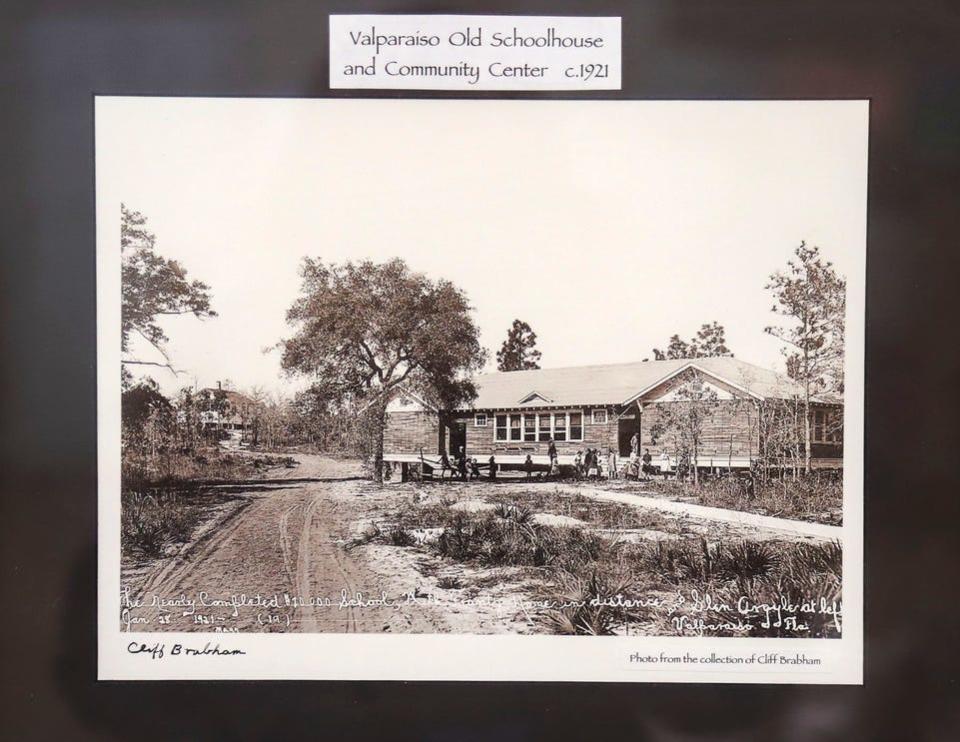 A photo from the collection of Cliff Brabham, dated 1921, hangs on the wall inside the Valparaiso Senior Citizen Club and shows the construction of the building as the Valparaiso schoolhouse and community center.