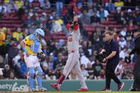 Washington Nationals' Joey Meneses (45) celebrates in front of Boston Red Sox catcher Reese McGuire, left, after hitting a solo home run during the second inning of a baseball game, Saturday, May 11, 2024, in Boston. (AP Photo/Michael Dwyer)