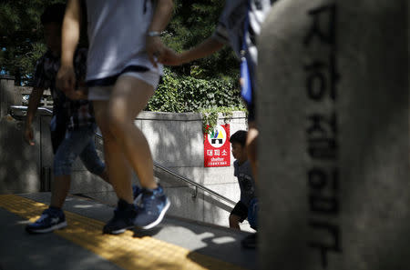 A sign of shelter is seen at an entrance of a subway station in Seoul, South Korea, August 11, 2017. REUTERS/Kim Hong-Ji