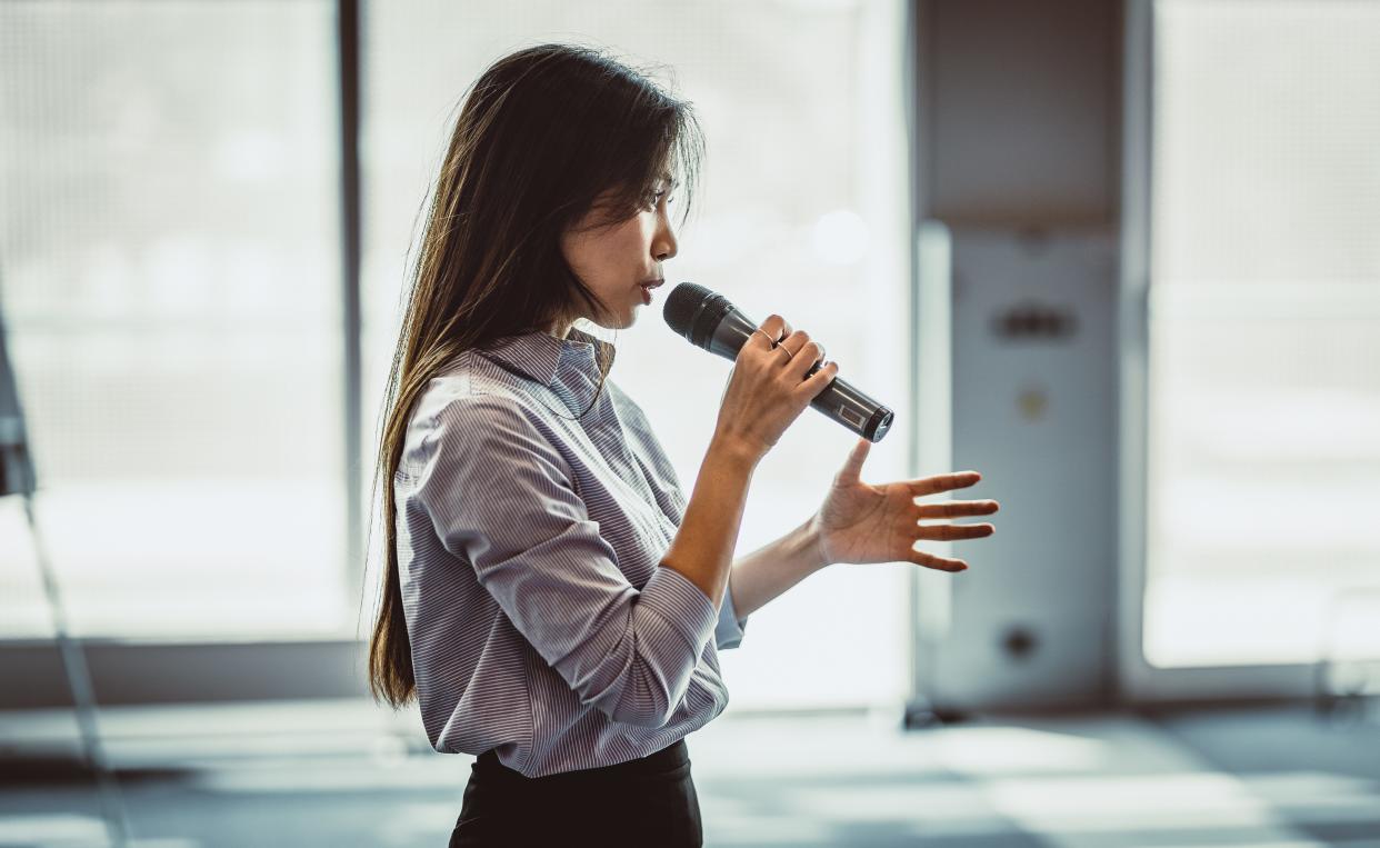 Woman speaking at a conference