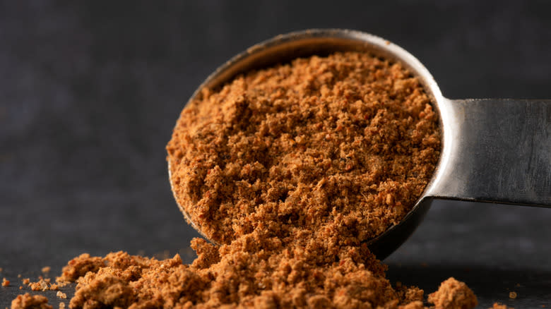 Brown taco seasoning with spoon