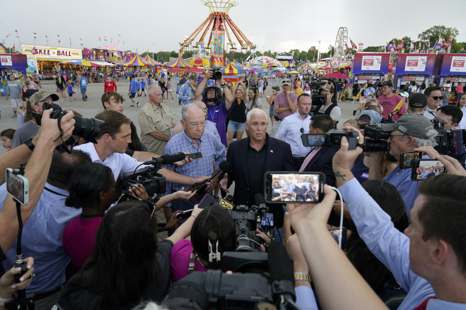 Former Vice President Mike Pence speaks to the media during a visit to the Iowa State Fair, Friday, Aug. 19, 2022, in Des Moines, Iowa. Potential White House hopefuls from both parties often swing by Iowa's legendary state fair during a midterm election year to connect with voters who could sway the nomination process. But this year, the traffic at the fair was noticeably light. Democrats are uncertain about President Joe Biden's political future and many Republicans avoid taking on former President Donald Trump. (AP Photo/Charlie Neibergall)