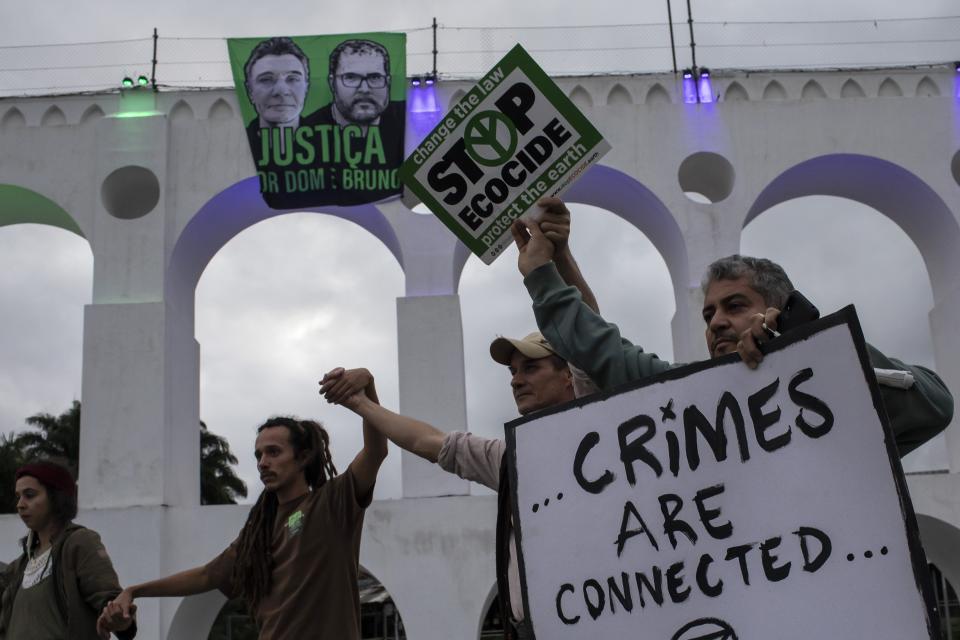 FILE - Social and environmental activists protest for justice in the deaths of British journalist Dom Phillips and Indigenous expert Bruno Pereira at the Arcos da Lapa aqueduct in Rio de Janeiro, Brazil, June 26, 2022. As the one-year anniversary of the murders approached, The Associated Press returned to the Javari Valley to describe the place where the two were killed. (AP Photo/Bruna Prado, File)