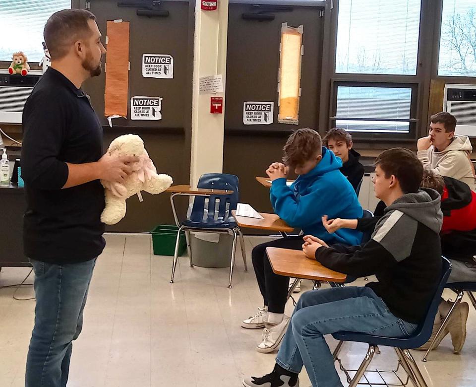 Andie Raber of Toward the Goal Ministries used a stuffed animal to demonstrate the power of building trust.