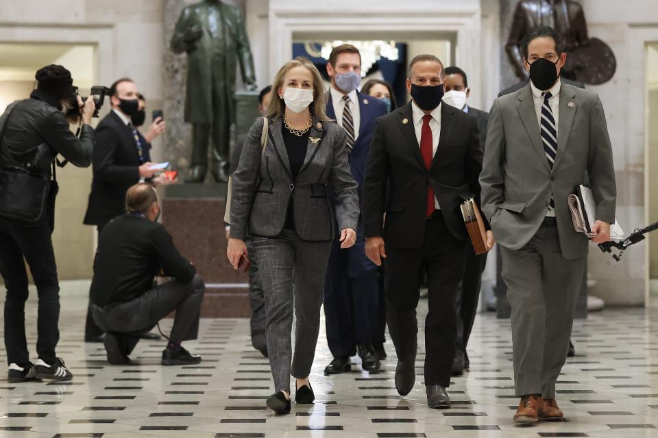 Impeachment managers (L-R) Rep. Madeleine Dean (D-PA), Rep. Eric Swalwell (D-CA), Rep. David Cicilline (D-RI), Rep. Jamie Raskin (D-MD) and others walk through Statuary Hall while heading to vote to impeach President Trump for the second time in little over a year in the House Chamber of the U.S. Capitol Jan. 13, 2021 in Washington, DC. The House voted 232-197 to impeach Trump on the charge of Òincitement of insurrection" after a mob attacked the U.S. Capitol where Congress was working to certify the Electoral College victory of President-elect Joe Biden on Jan. 6. 10 Republicans voted to impeach.