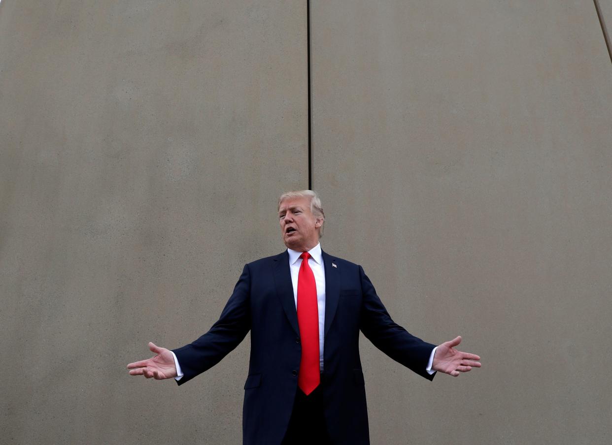 FILE - In this March 13, 2018, file photo, President Donald Trump speaks during a tour as he reviews border wall prototypes in San Diego. A relentless stream of U.S. policy shifts in 2018 has amounted to one of the boldest attacks on all types of immigration that the country has ever seen. Some see it as a tug-of-war between foundational national ideals and a fight for a new path forward led by Trump. (AP Photo/Evan Vucci, File) ORG XMIT: NYAG503