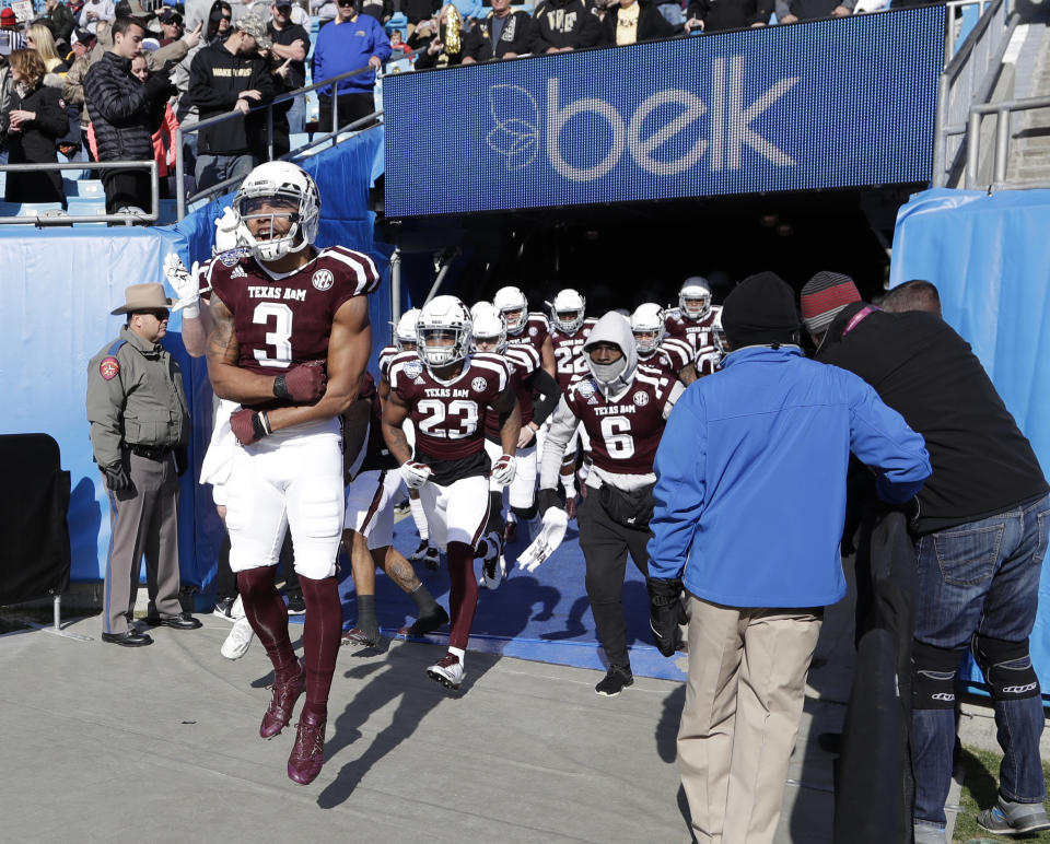 Texas A&M’s Christian Kirk (3) leads the team onto the field before the Belk Bowl NCAA college football game against Wake Forest in Charlotte, N.C., Friday, Dec. 29, 2017. (AP Photo/Chuck Burton)