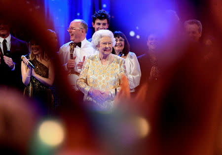 Britain's Queen Elizabeth smiles on stage during a special concert "The Queen's Birthday Party" to celebrate her 92nd birthday at the Royal Albert Hall in London, Britain April 21, 2018. Andrew Parsons/Pool via Reuters