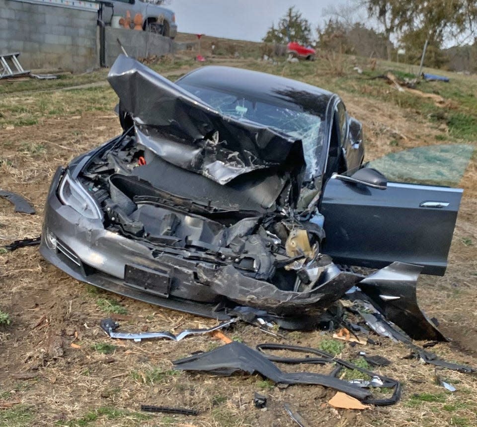 Police say Cynthia Sullivan's Tesla was rammed and demolished by a truck allegedly driven by a man charged with assaulting her.