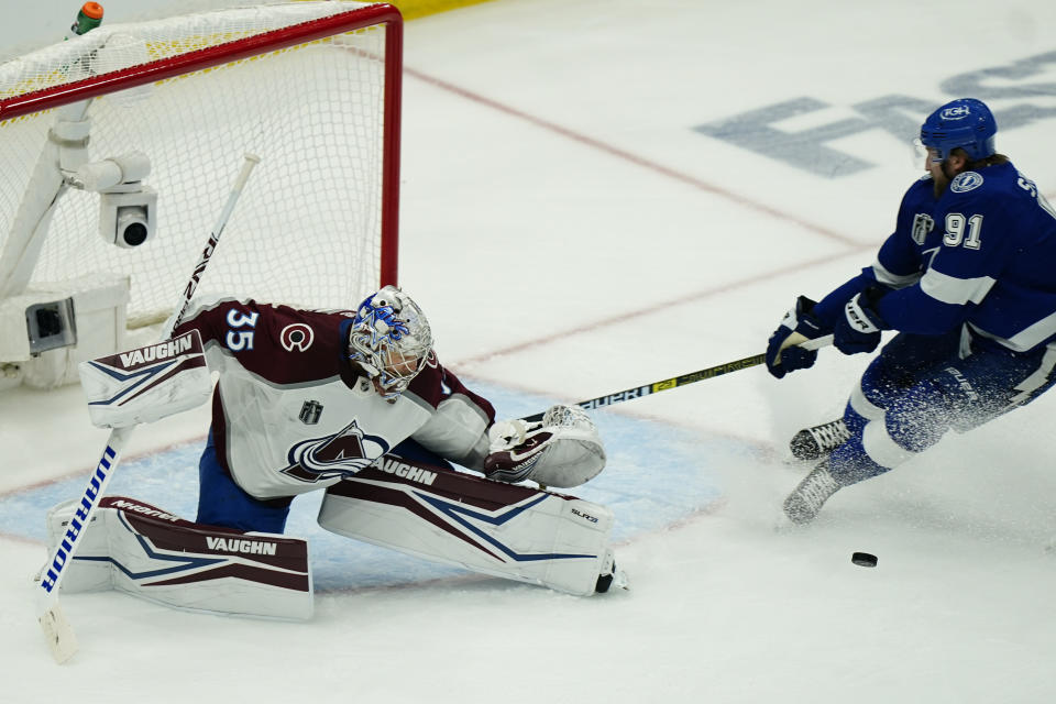 Colorado Avalanche goaltender Darcy Kuemper (35) deflects shot by Tampa Bay Lightning center Steven Stamkos (91) during the first period of Game 6 of the NHL hockey Stanley Cup Finals on Sunday, June 26, 2022, in Tampa, Fla. (AP Photo/John Bazemore)