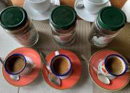 Mixed cups of coffee samples are seen at the Kafen Drazana packaging of the Bourbon pointu coffee variety in Ampefy town of Itasy region