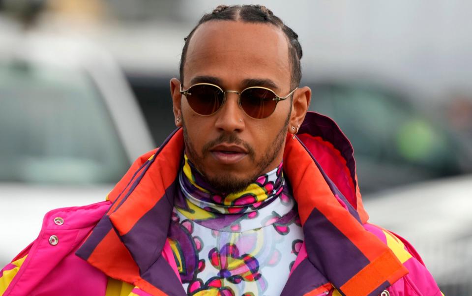 Mercedes driver Lewis Hamilton of Britain arrives at the Silverstone race track in Silverstone - AP Photo/Frank Augstein