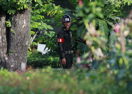 A military policeman stands guard before Thailand's Prime Minister Prayuth Chan-ocha arrives at the Education Ministry in Bangkok, Thailand, May 21, 2015. REUTERS/Chaiwat Subprasom