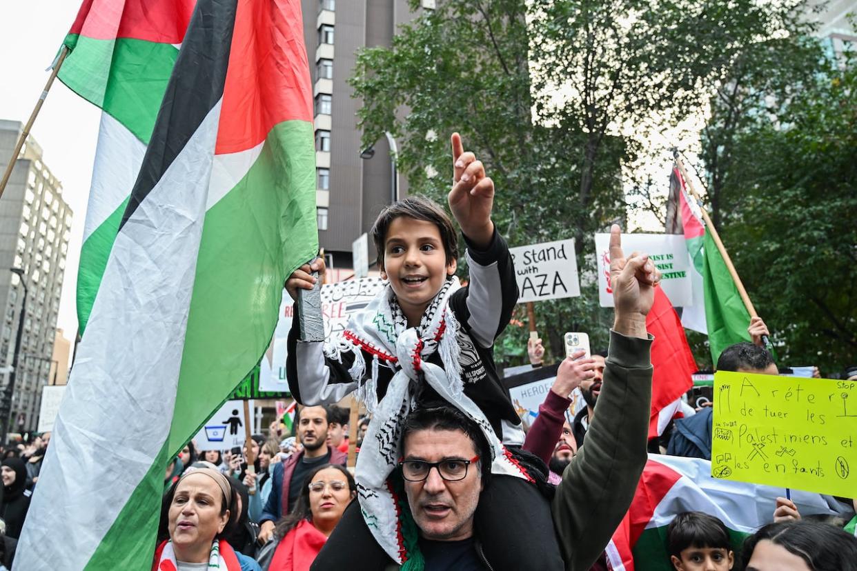 People take part in a protest in support of Palestinians in Montreal on October 13, 2023. (Graham Hughes/The Canadian Press - image credit)