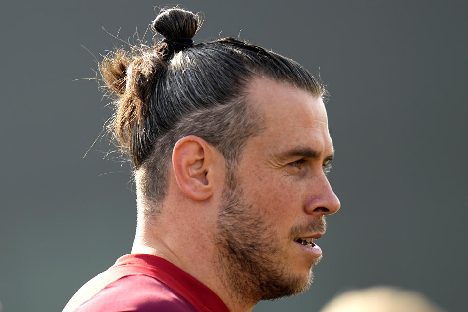 Wales' Gareth Bale watches teammates train during Wales' official training session on the eve of the group B World Cup soccer match between USA and Wales, in Doha, Qatar, Sunday, Nov. 20, 2022. (AP Photo/Aijaz Rahi)