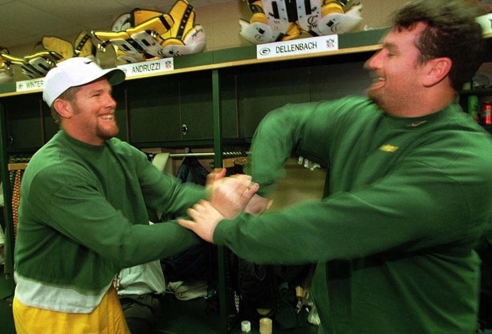 Green Bay Packers quarterback Brett Favre, left, and center Frank Winters have some fun in the locker room before practice Thursday, Jan. 15, 1998, in Green Bay, Wis.