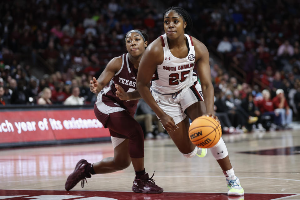South Carolina guard Raven Johnson, right, drives past Texas A&M guard Kay Kay Green during the first half of an NCAA college basketball game in Columbia, S.C., Thursday, Dec. 29, 2022. (AP Photo/Nell Redmond)