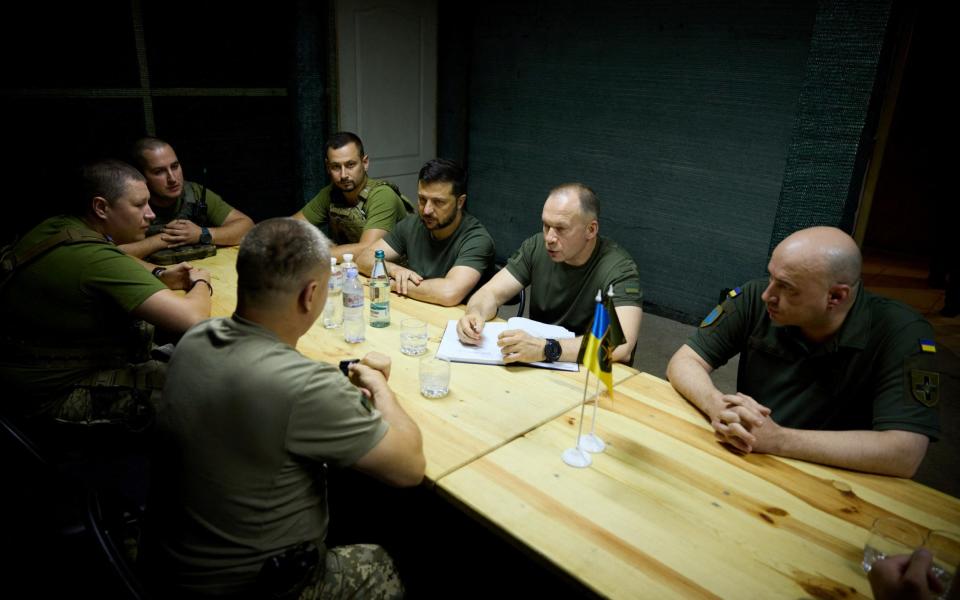 Ukraine's president attends a meeting with commanders of the country's Armed Forces brigades as he visits the frontline near Bakhmut