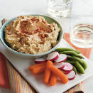 <p>It’s a quick snack to make before dinner. Throw all the ingredients into a food processor, give it a whirl, and presto−you’ve bought yourself an hour to make a meal. Healthy dippers include baby carrots, radishes, jicama, and sugar snap peas.</p> <p><a rel="nofollow noopener" href="http://www.myrecipes.com/recipe/happy-hour-hummus" target="_blank" data-ylk="slk:View Recipe: Happy-Hour Hummus;elm:context_link;itc:0;sec:content-canvas" class="link ">View Recipe: Happy-Hour Hummus</a></p>